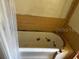 Close up of a yellow tiled bathtub with shower curtain at 3619 18Th E St, Bradenton, FL 34208