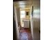 Narrow bathroom view includes a vanity, toilet, and glimpses of a bathtub at 3619 18Th E St, Bradenton, FL 34208