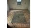 Aged bedroom with window-mounted AC, worn walls and flooring at 3619 18Th E St, Bradenton, FL 34208