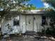 Modest single-story home featuring a white exterior and a simple front entry at 3619 18Th E St, Bradenton, FL 34208