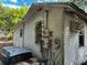 Exterior of a house with white siding and an visible A/C unit at 3619 18Th E St, Bradenton, FL 34208