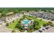 Stunning aerial view of community pool, clubhouse and manicured landscaping in a residential neighborhood at 3684 Fescue Ln, Sarasota, FL 34232
