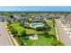 Community pool area surrounded by lush landscaping and well-maintained lawns offering a relaxing retreat at 3684 Fescue Ln, Sarasota, FL 34232