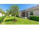 A beautiful lawn with a screened-in patio provides ample space for outdoor enjoyment at 3684 Fescue Ln, Sarasota, FL 34232