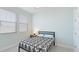 Cozy bedroom with natural light, comfortable bed, and stylish decor at 3684 Fescue Ln, Sarasota, FL 34232