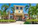 Community clubhouse with tropical landscaping, providing a welcoming and convenient gathering space at 3684 Fescue Ln, Sarasota, FL 34232