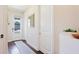 Bright entryway with hardwood floors and a view of the front door and neighborhood at 3684 Fescue Ln, Sarasota, FL 34232