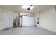 This spacious garage has epoxy flooring and built-in storage cabinets and shelving at 3684 Fescue Ln, Sarasota, FL 34232