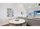 The living room has a comfortable sofa, accent art, dining table, and window to let the light in at 3684 Fescue Ln, Sarasota, FL 34232