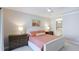 Spacious main bedroom features a tray ceiling, ceiling fan, and ensuite bathroom at 3684 Fescue Ln, Sarasota, FL 34232