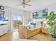Bright bedroom with balcony, a large bed, TV, and a serene coastal view at 3730 Cadbury Cir # 631, Venice, FL 34293