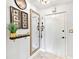 Bright entryway featuring a large mirror and marble floors at 3730 Cadbury Cir # 631, Venice, FL 34293