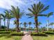 Beautiful water fountain surrounded by palm trees and well-maintained landscaping, creating a serene outdoor setting at 3730 Cadbury Cir # 631, Venice, FL 34293