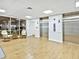 Bright lobby area with elevators and comfortable seating, providing a welcoming entrance for residents and guests at 3730 Cadbury Cir # 631, Venice, FL 34293