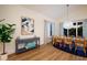 Stylish dining room with seating for six, coastal decor, and tile floors at 408 Magnolia Ave, Anna Maria, FL 34216