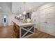 Stylish kitchen with a large island, decorative finishes, and stainless steel appliances at 408 Magnolia Ave, Anna Maria, FL 34216