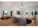 Open concept living space featuring a dining area, comfortable seating, and access to the outdoors at 408 Magnolia Ave, Anna Maria, FL 34216