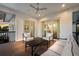 Comfortable, covered outdoor patio with stylish seating offering beautiful views and easy access to indoor spaces at 408 Magnolia Ave, Anna Maria, FL 34216