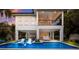 Beautiful backyard showcasing a private pool with lounge chairs and an outdoor living area at 408 Magnolia Ave, Anna Maria, FL 34216