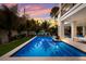 Lovely outdoor pool area with a serene backyard and a vibrant sunset view at 408 Magnolia Ave, Anna Maria, FL 34216