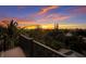 Breathtaking sunset view from the balcony, showcasing lush greenery and vibrant skies at 408 Magnolia Ave, Anna Maria, FL 34216