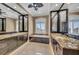 Elegant bathroom featuring granite countertops, dual sinks, and a luxurious soaking tub at 416 Casey Key Rd, Nokomis, FL 34275