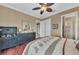 Bedroom with hardwood floors, ceiling fan, and an ensuite bathroom at 416 Casey Key Rd, Nokomis, FL 34275
