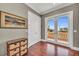 Bright bedroom with wood floors, balcony access and natural lighting at 416 Casey Key Rd, Nokomis, FL 34275