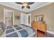A bedroom with hardwood floors and an ensuite bathroom at 416 Casey Key Rd, Nokomis, FL 34275