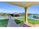 Waterfront view from covered patio with a boat dock, offering convenient water access and scenic views at 416 Casey Key Rd, Nokomis, FL 34275