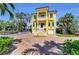 Elegant two-story home with a stucco exterior, dual garages, and well-manicured landscaping at 416 Casey Key Rd, Nokomis, FL 34275