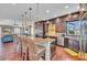 The kitchen has a large island with bar seating, and stainless-steel appliances at 416 Casey Key Rd, Nokomis, FL 34275