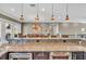 Open kitchen with bar seating and modern stainless steel appliances at 416 Casey Key Rd, Nokomis, FL 34275