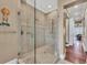 Modern glass shower with elegant tile design and dual shower heads at 416 Casey Key Rd, Nokomis, FL 34275