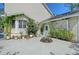 View of backyard of home featuring flower pots, green foliage, and a garden area at 4326 Brackenwood Ct, Sarasota, FL 34232