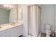 Bathroom featuring a single sink vanity, medicine cabinet, toilet, and shower with curtain at 4326 Brackenwood Ct, Sarasota, FL 34232