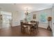 The dining room offers a chandelier and light-filled windows at 4326 Brackenwood Ct, Sarasota, FL 34232