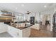 Modern kitchen featuring white cabinets, dark countertops, stainless steel appliances and tiled floor at 4326 Brackenwood Ct, Sarasota, FL 34232