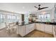 Bright kitchen with a center island, modern appliances, and a breakfast nook bathed in natural light at 4326 Brackenwood Ct, Sarasota, FL 34232