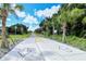 A view of the Legacy Trail highlighting the path, directional arrows, and scenic palm trees at 4326 Brackenwood Ct, Sarasota, FL 34232