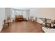 Spacious living room with hardwood floors and variety of instruments displayed at 4326 Brackenwood Ct, Sarasota, FL 34232