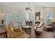 This spacious living room showcases high ceilings, abundant natural light, and elegant furniture at 4326 Brackenwood Ct, Sarasota, FL 34232