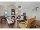 Living room with a fireplace, a piano, and an airy feel at 4326 Brackenwood Ct, Sarasota, FL 34232
