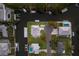 Aerial view of a luxurious neighborhood showcasing waterfront homes with private docks and serene canal access at 4517 Pinfish Ln, Palmetto, FL 34221