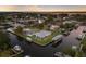 Stunning aerial view of waterfront property with private boat docks, beautifully landscaped yard at 4517 Pinfish Ln, Palmetto, FL 34221