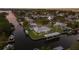 Beautiful aerial view of a waterfront property with private boat docks, perfectly landscaped yard at 4517 Pinfish Ln, Palmetto, FL 34221