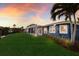 Beautiful waterfront property with lush lawn, covered patio and access to the canal at 4517 Pinfish Ln, Palmetto, FL 34221
