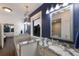Elegant bathroom with double vanity, granite counters, and a large soaking tub at 4517 Pinfish Ln, Palmetto, FL 34221