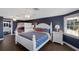 Well-lit bedroom featuring a bunk bed, queen bed, and modern furnishings at 4517 Pinfish Ln, Palmetto, FL 34221