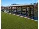 Boat dock featuring boat lift and covered area, ensuring easy access for boating activities at 4517 Pinfish Ln, Palmetto, FL 34221